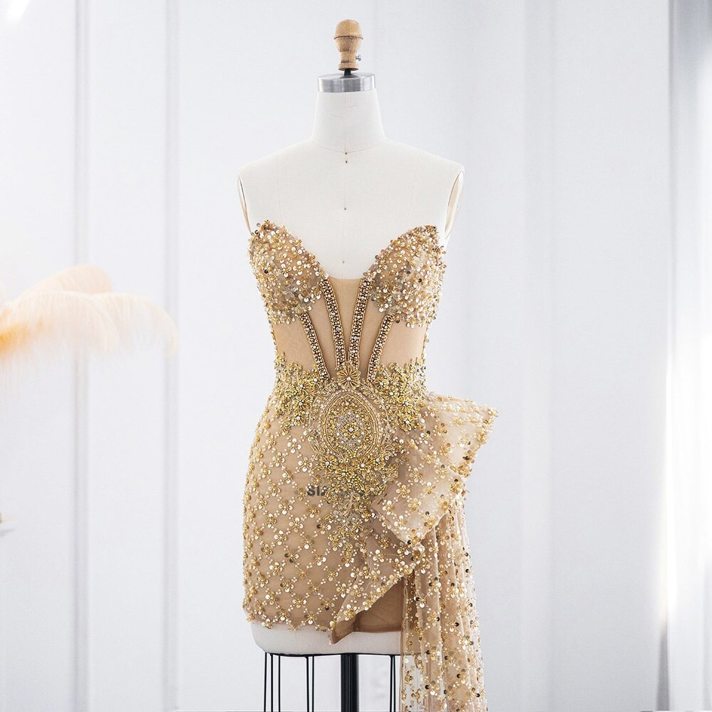 Mini dress with golden rhinestones